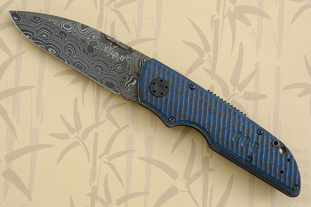 STUD II: Damascus with Black & Blue Grooved G10