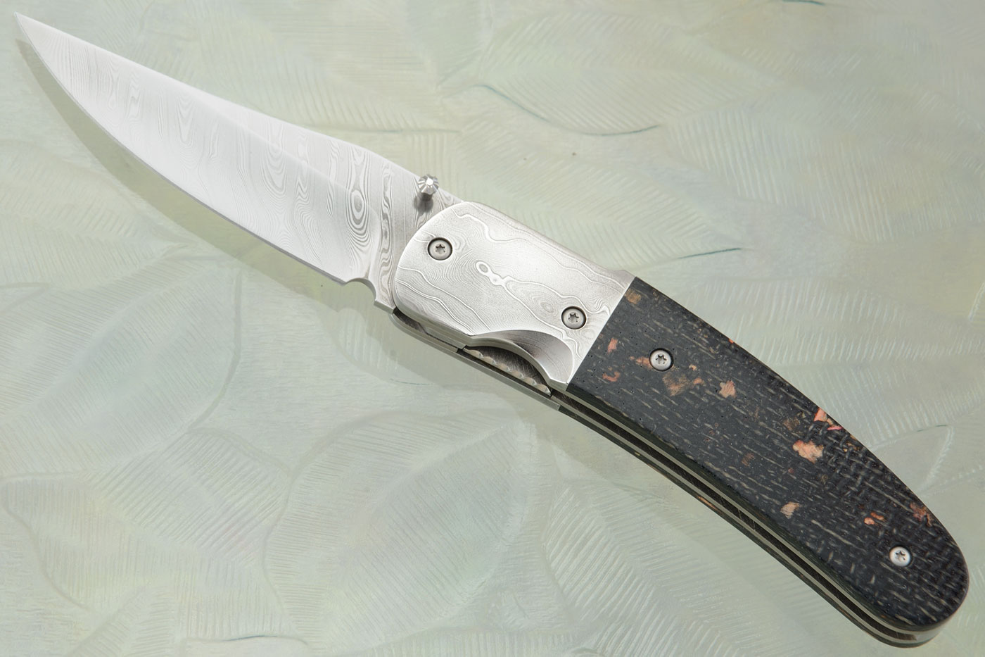 Clip Point Folder with Stainless Damascus and Wood Chip Burlap Micarta