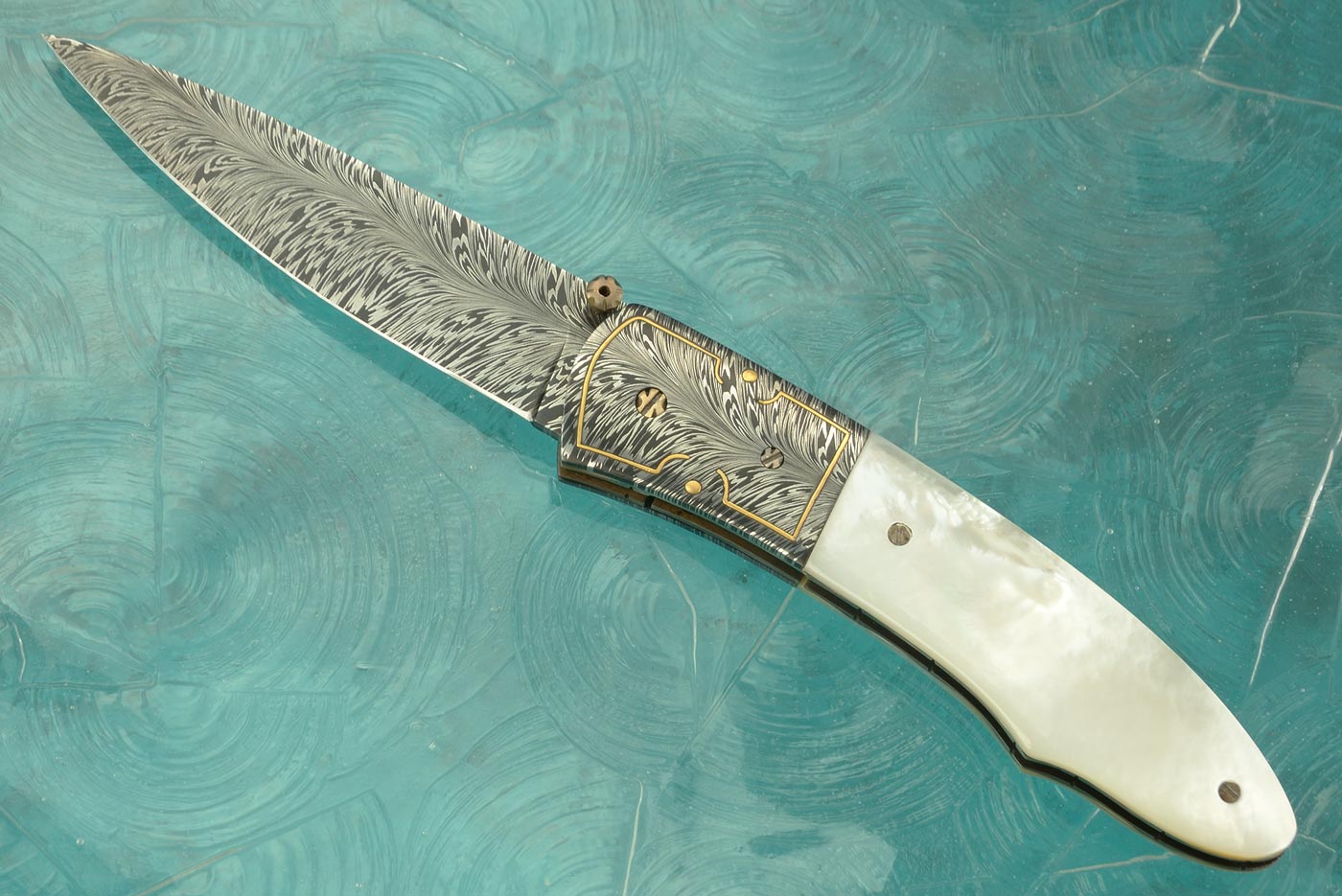 Engraved Feather Damascus Folder with Mother of Pearl
