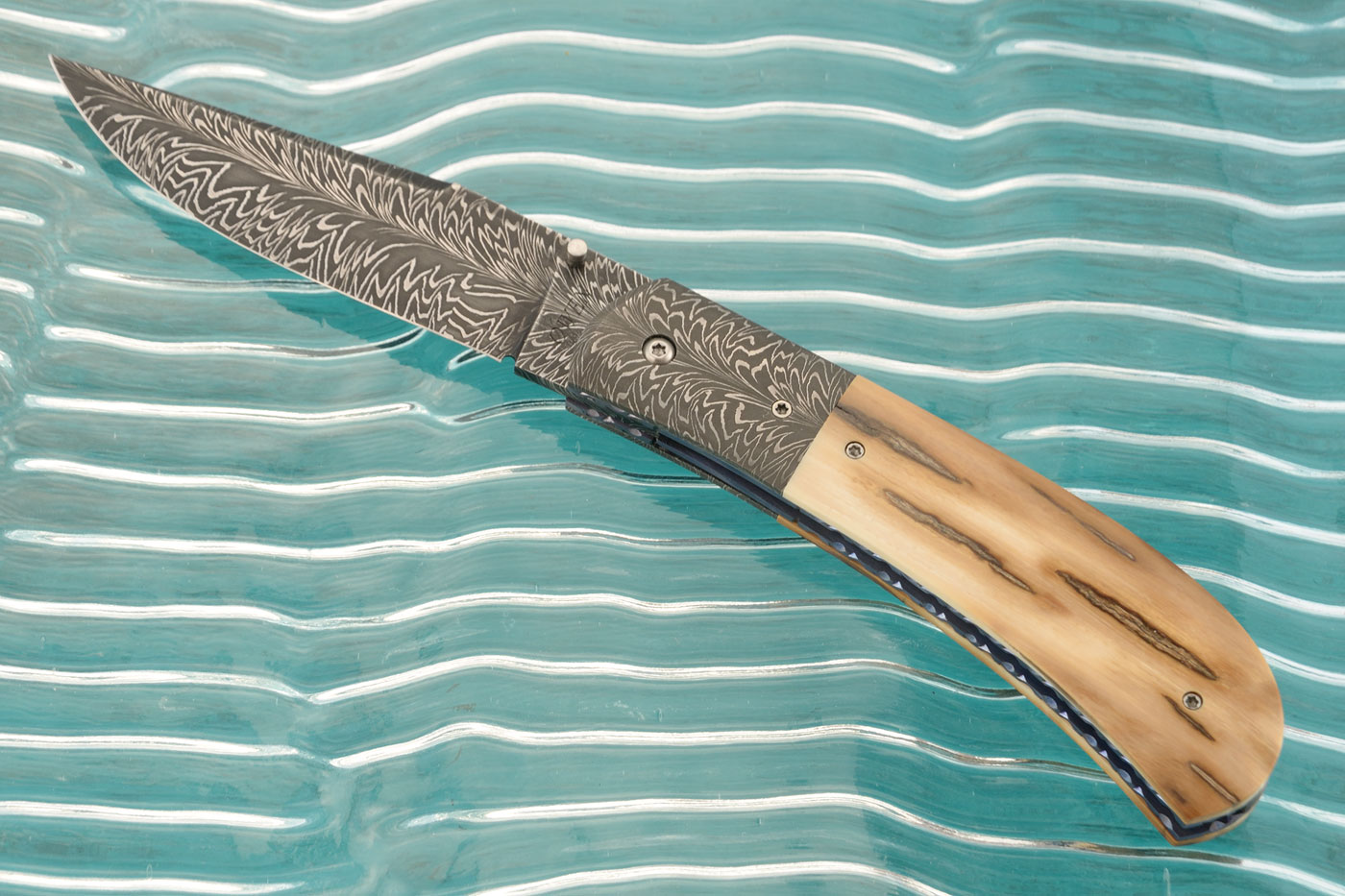 Mammoth Ivory and Feather Damascus Folder