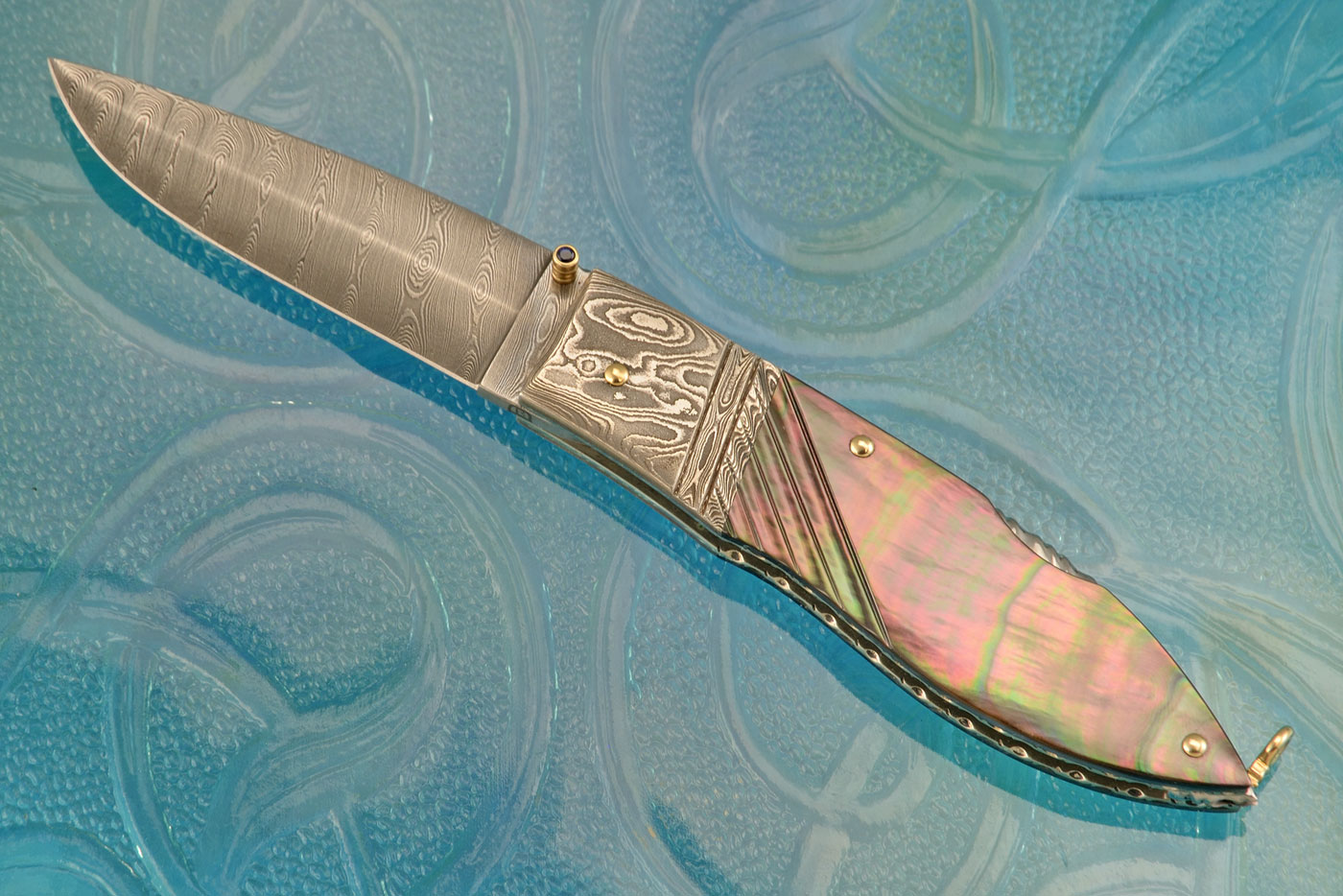 Damascus Lockback with Blacklip Mother of Pearl