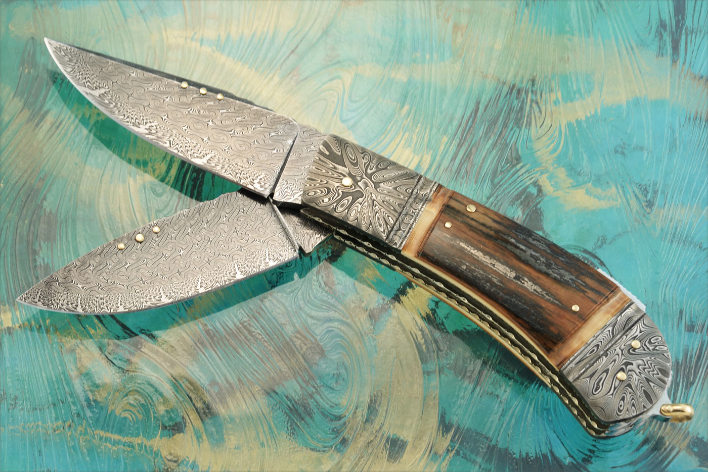 Two Blade Damascus Backlock with Mammoth Ivory