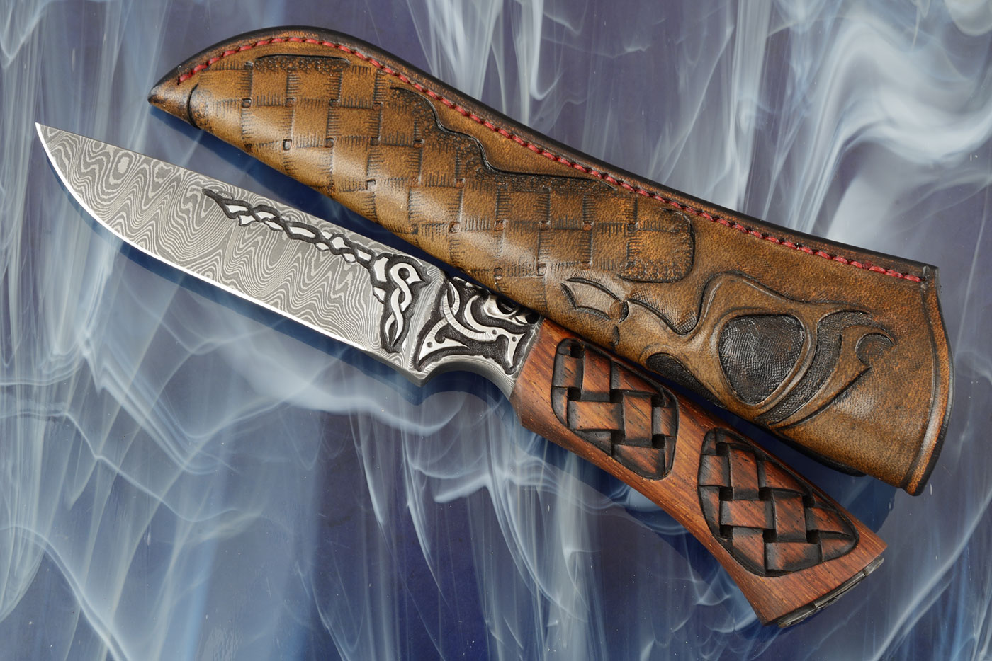 Skulls: Integral Damascus Utility with Carved Tigerwood